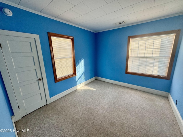 carpeted empty room with ornamental molding