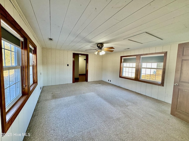 spare room featuring wood ceiling, ceiling fan, and carpet