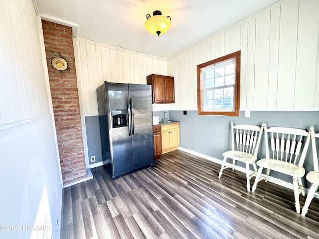 kitchen featuring dark wood-type flooring and stainless steel fridge with ice dispenser