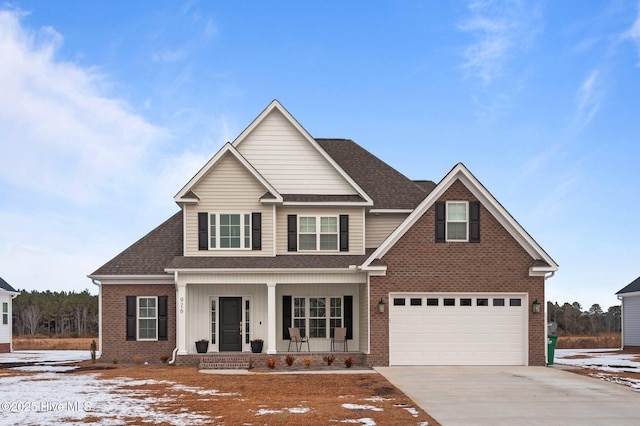 view of front of property featuring a garage and covered porch