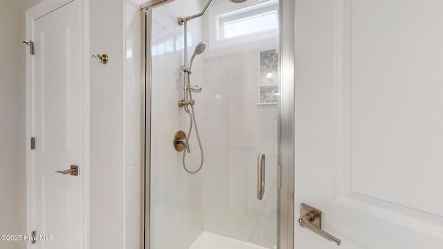 bathroom featuring an enclosed shower