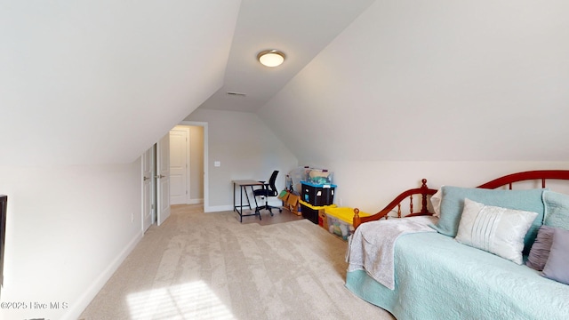 carpeted bedroom featuring lofted ceiling