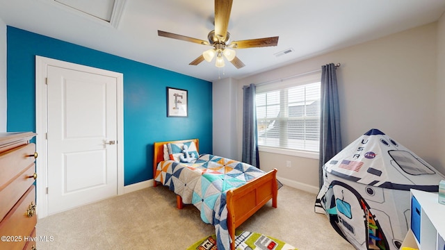 carpeted bedroom with ceiling fan