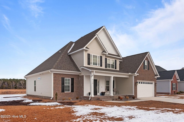 view of front of home with a garage and covered porch