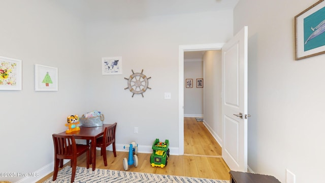 hallway with hardwood / wood-style floors