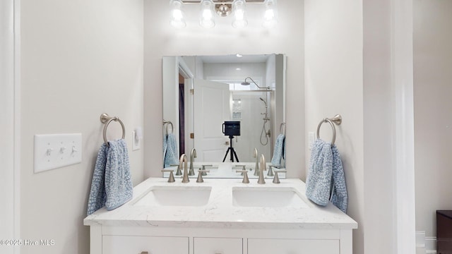 bathroom with vanity and a shower with shower door