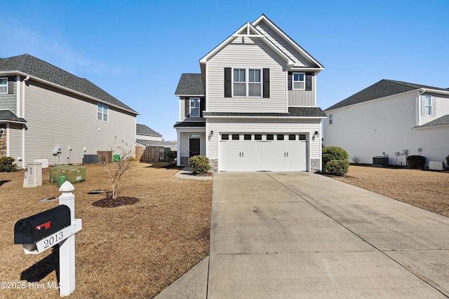 front facade featuring a garage, cooling unit, and a front lawn