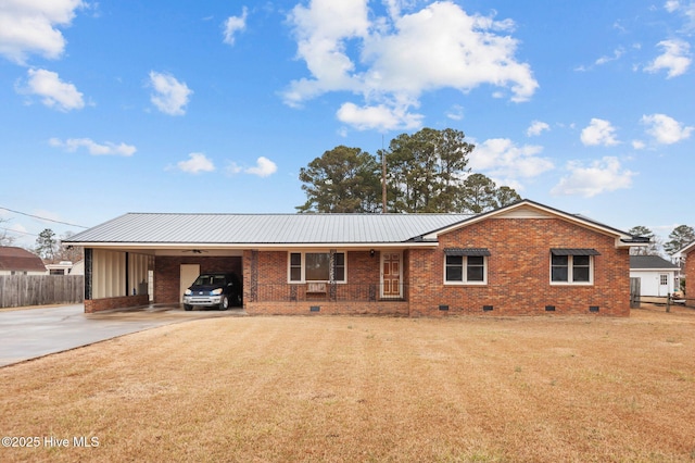 view of front of property with a front yard and a carport