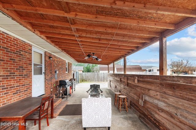 view of patio with ceiling fan and a grill