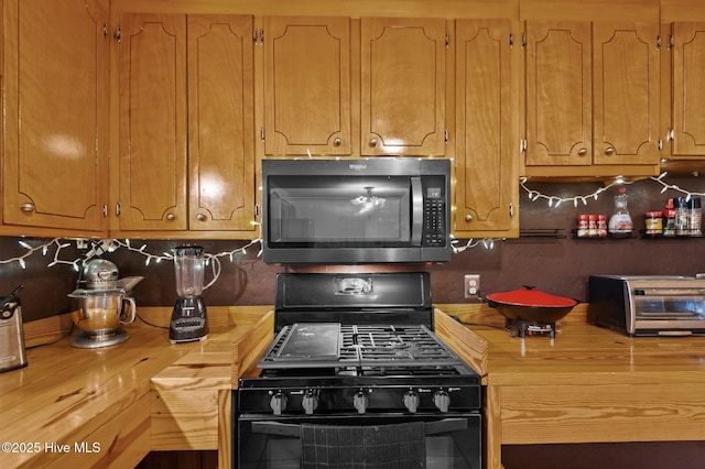 kitchen featuring wooden counters, gas stove, and backsplash