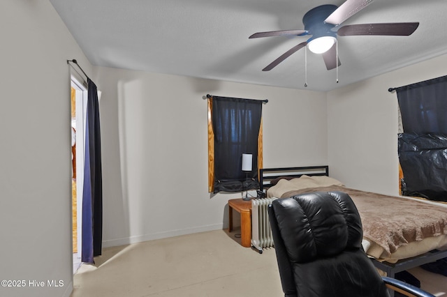 bedroom featuring radiator heating unit and ceiling fan