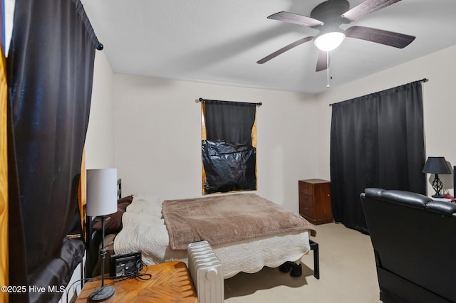 bedroom with light colored carpet and ceiling fan