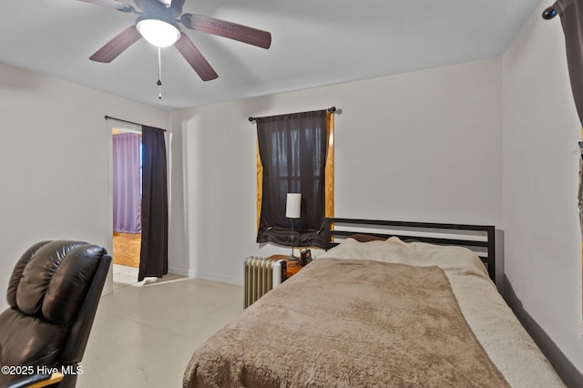 bedroom featuring ceiling fan and radiator