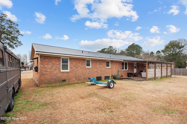 back of house with a yard and a patio area