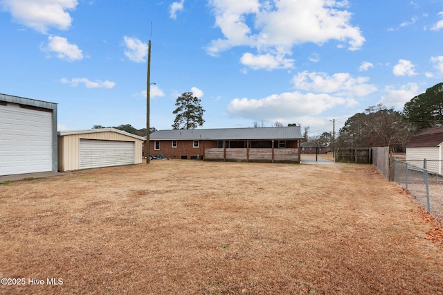 exterior space featuring a garage and an outdoor structure