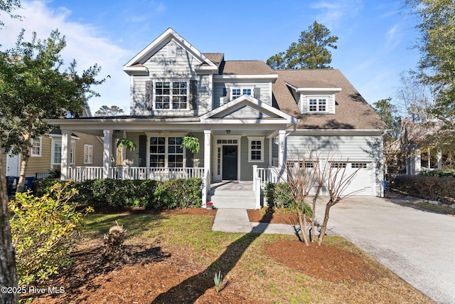 view of front facade with covered porch and a garage