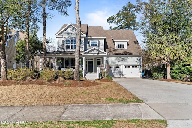 view of front of home featuring covered porch and a garage