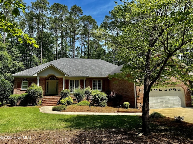 205 Firestone Ct, New Bern, NC 28562 - ranch-style home featuring brick siding, driveway, a front lawn, roof with shingles, and a garage