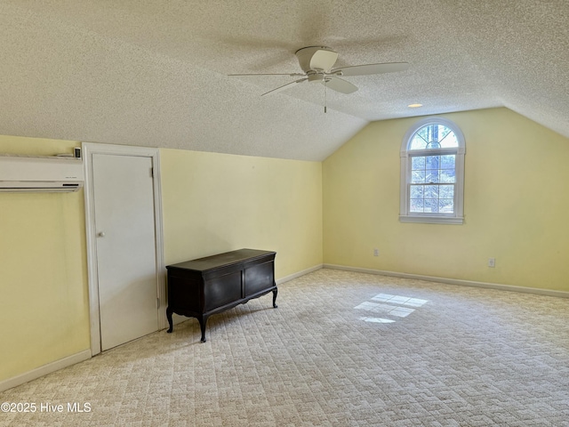 bonus room featuring carpet floors, baseboards, and a textured ceiling