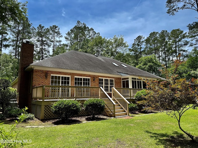 205 Firestone Ct, New Bern, NC 28562 - back of property with a chimney, brick siding, a yard, and a deck
