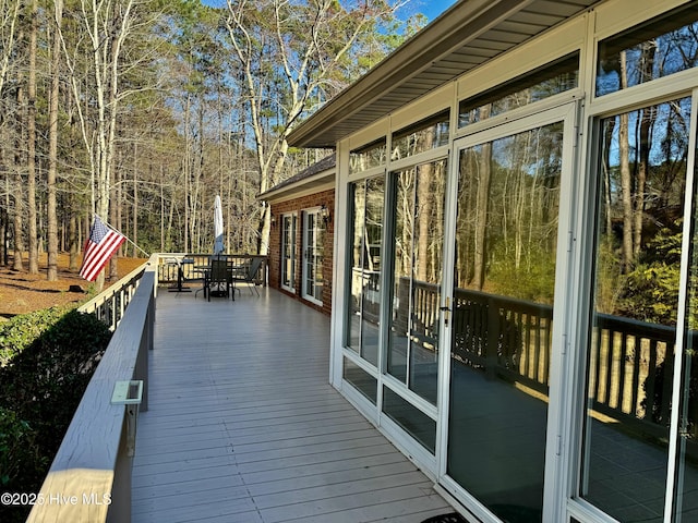 wooden deck with outdoor dining area