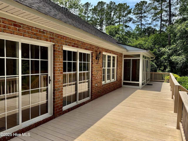 205 Firestone Ct, New Bern, NC 28562 - deck with a sunroom and view of wooded area