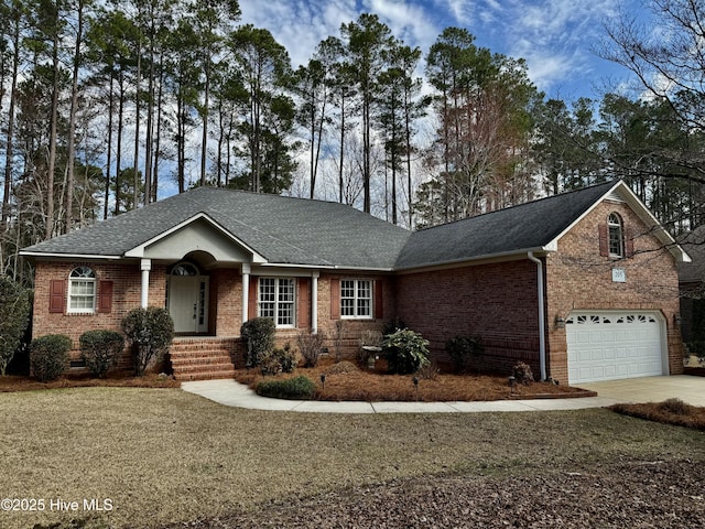 single story home with driveway, a garage, a shingled roof, crawl space, and brick siding