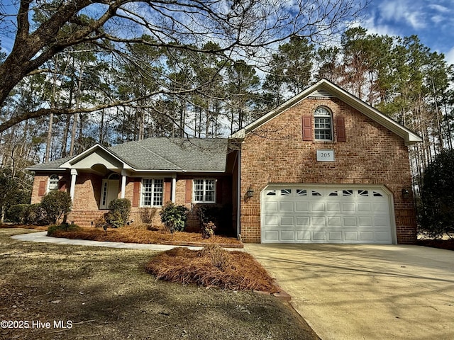 view of front of home featuring a garage, concrete driveway, brick siding, and a shingled roof