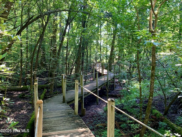 view of dock featuring a forest view