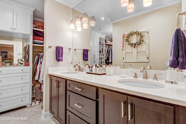 bathroom with vanity, tile patterned flooring, and crown molding