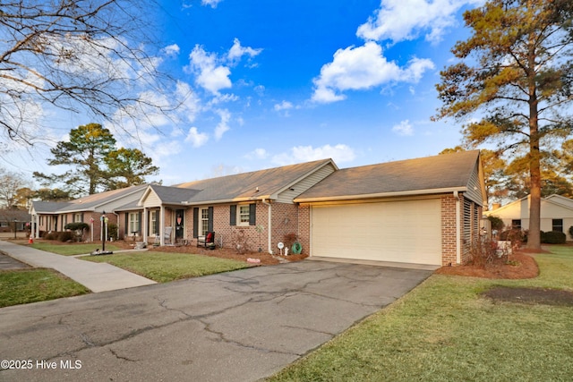 single story home featuring a garage and a front yard