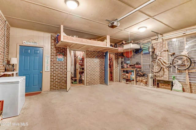 garage featuring a garage door opener and fridge