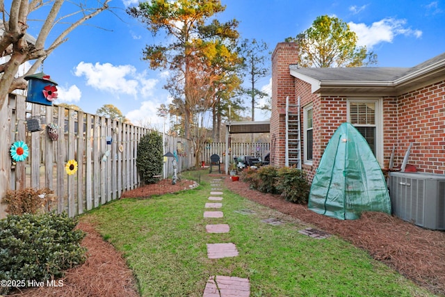 view of yard with central AC unit