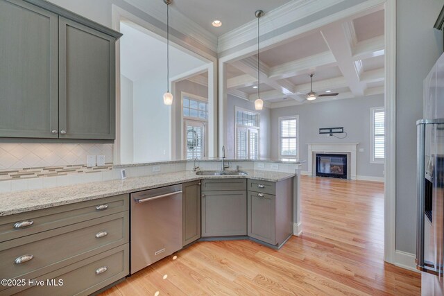 unfurnished room with ornamental molding, ceiling fan, and light wood-type flooring