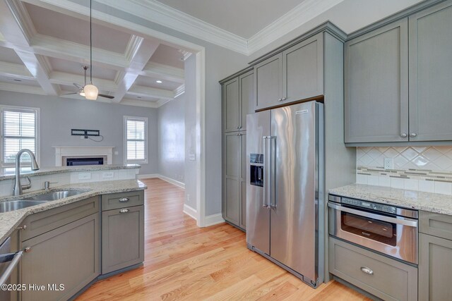 unfurnished bedroom with crown molding, a closet, and light wood-type flooring