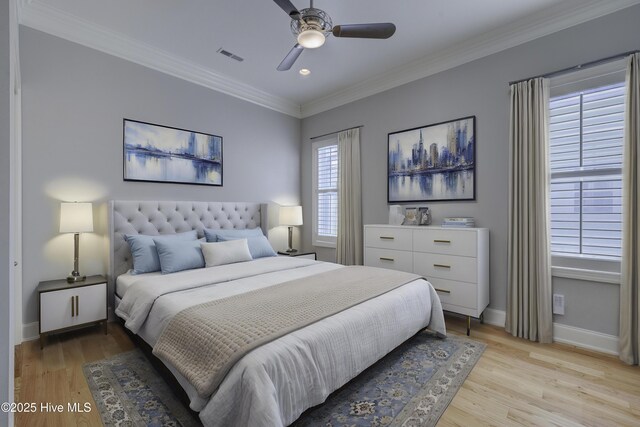 unfurnished bedroom featuring multiple windows, ornamental molding, light wood-type flooring, and a closet