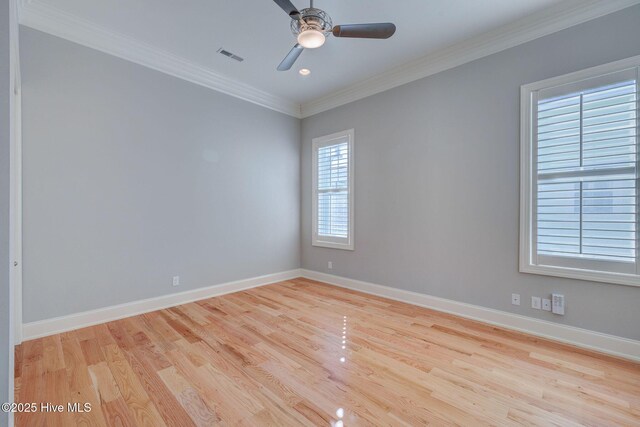 unfurnished bedroom featuring ensuite bathroom, light hardwood / wood-style flooring, ornamental molding, a closet, and ceiling fan