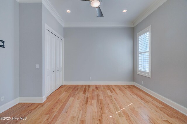 spare room with ceiling fan, ornamental molding, and light hardwood / wood-style flooring