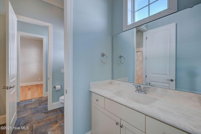 bathroom with vanity and toilet