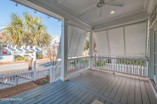 wooden terrace featuring a porch and ceiling fan