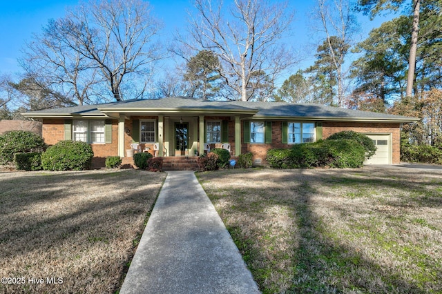 view of front of property with a garage and a front lawn