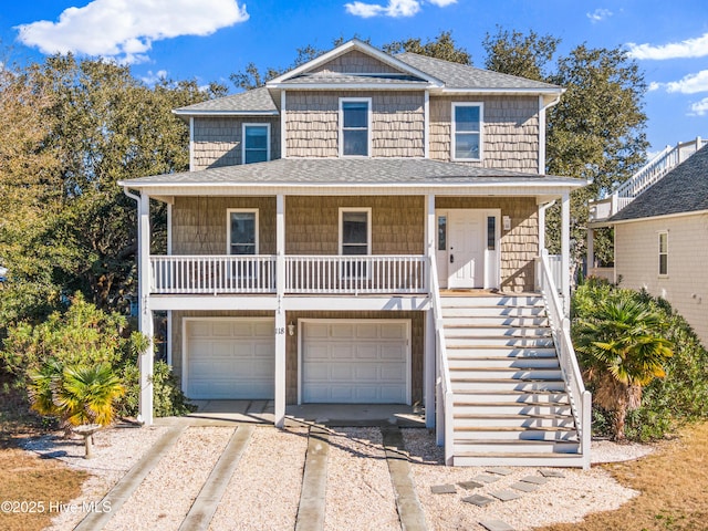 view of front of property with a garage and covered porch