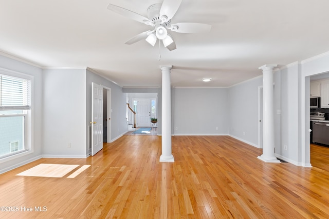 unfurnished living room featuring ornate columns, crown molding, and light hardwood / wood-style flooring