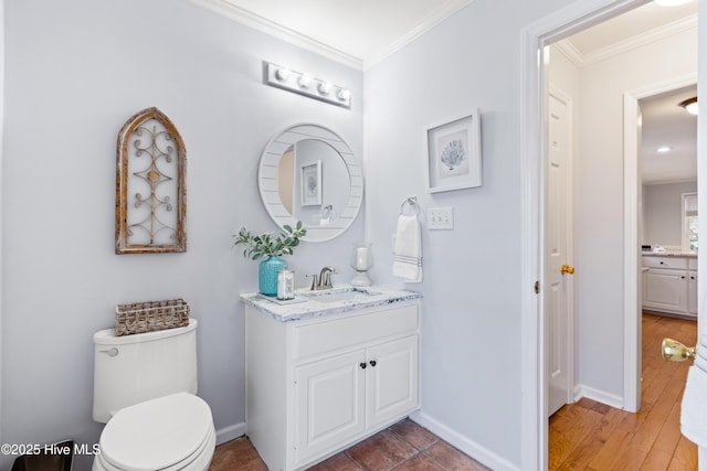 bathroom featuring vanity, crown molding, toilet, and hardwood / wood-style flooring