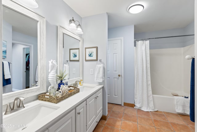 bathroom with tile patterned floors, shower / tub combo, and vanity