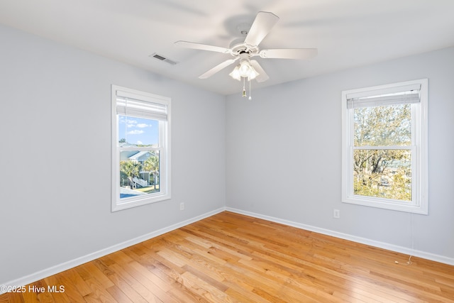 unfurnished room featuring ceiling fan and light wood-type flooring