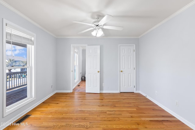 unfurnished bedroom with crown molding, ceiling fan, and light hardwood / wood-style floors