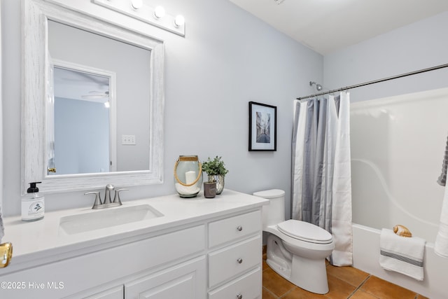 full bathroom featuring tile patterned floors, toilet, vanity, and shower / bath combo