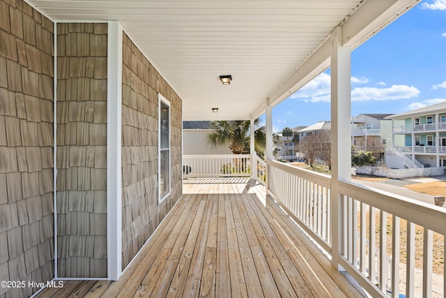 wooden terrace featuring a porch