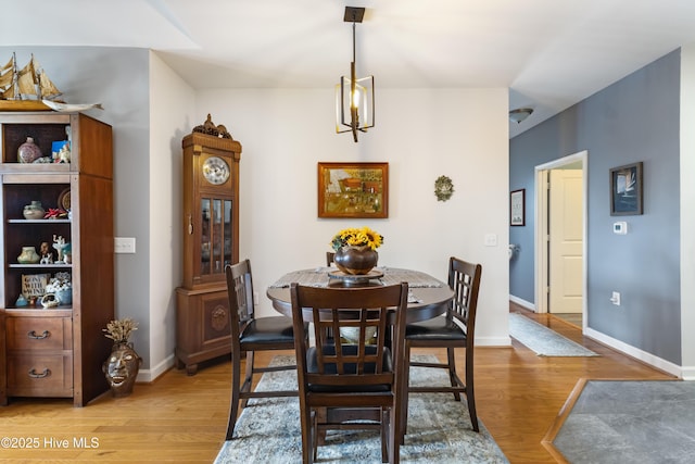 dining space featuring light wood-type flooring